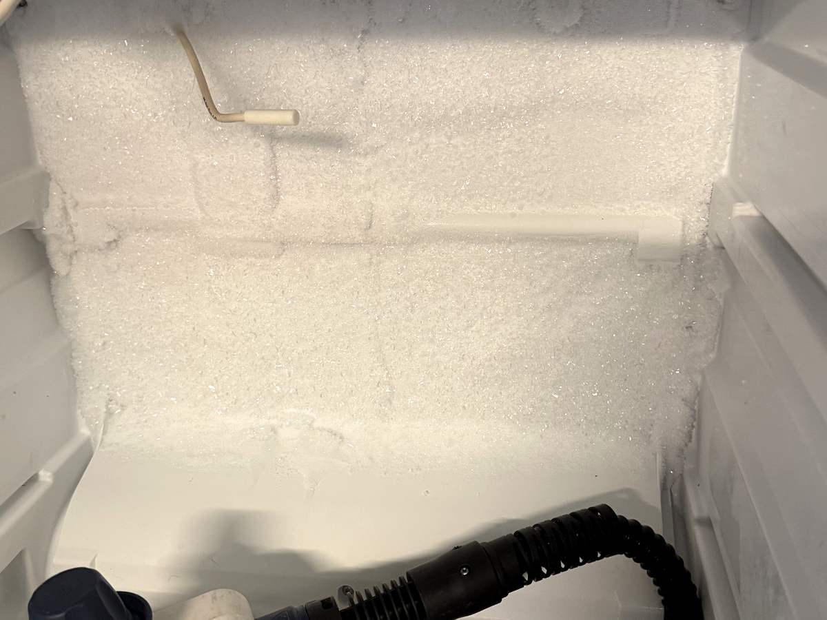 Iced-over evaporator being steam-defrosted in a Liebherr freezer in Gig Harbor