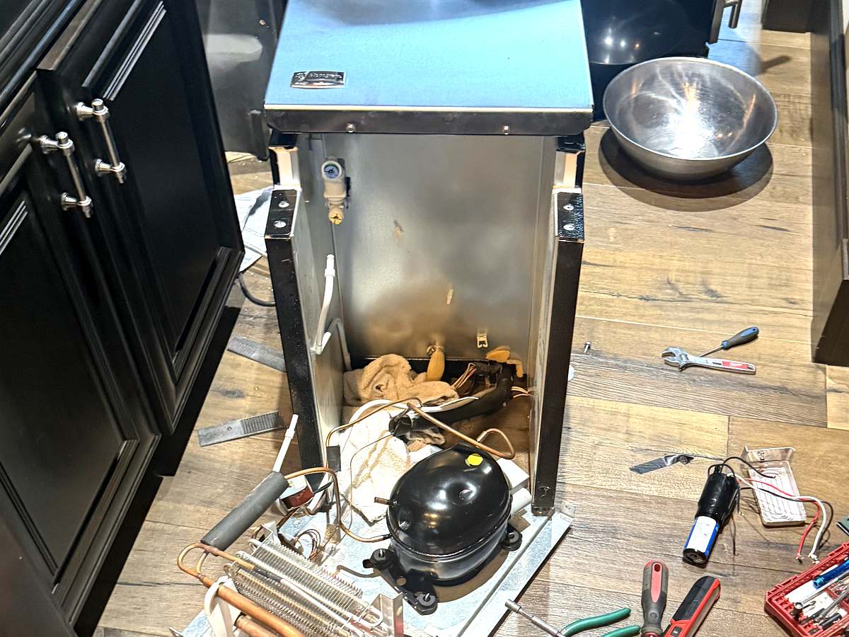 GE Monogram wine cooler pulled out for sealed system repair in a Sammamish kitchen